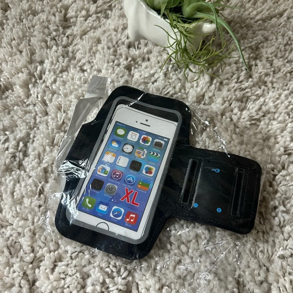 Brand new in package exercise phone holder for iPhones arm wrap gym yoga…
